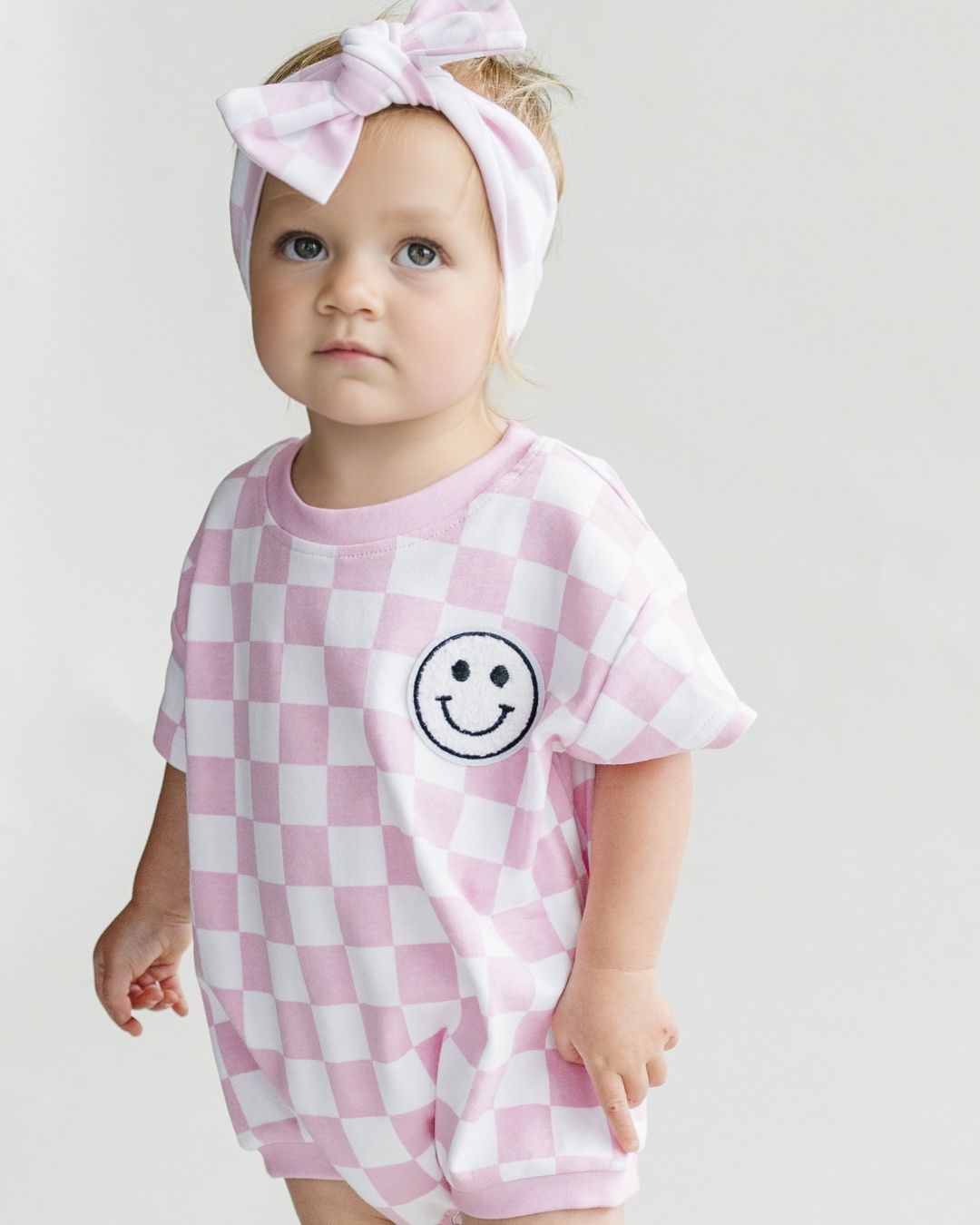 Short Sleeve Bubble Romper | Checkered Smiley Pink